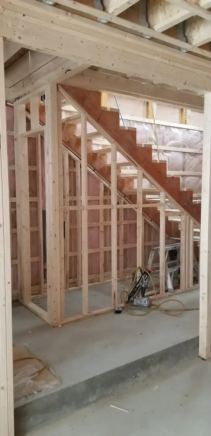 Cage d’escalier reconstruite en ossature de bois neuve